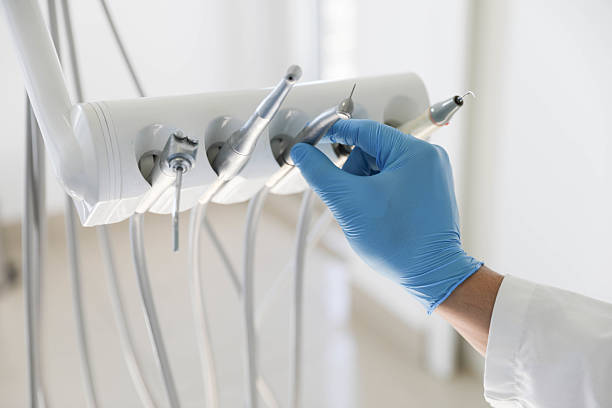 Professional Root Canal Treatment technician working in New Cassel, NY